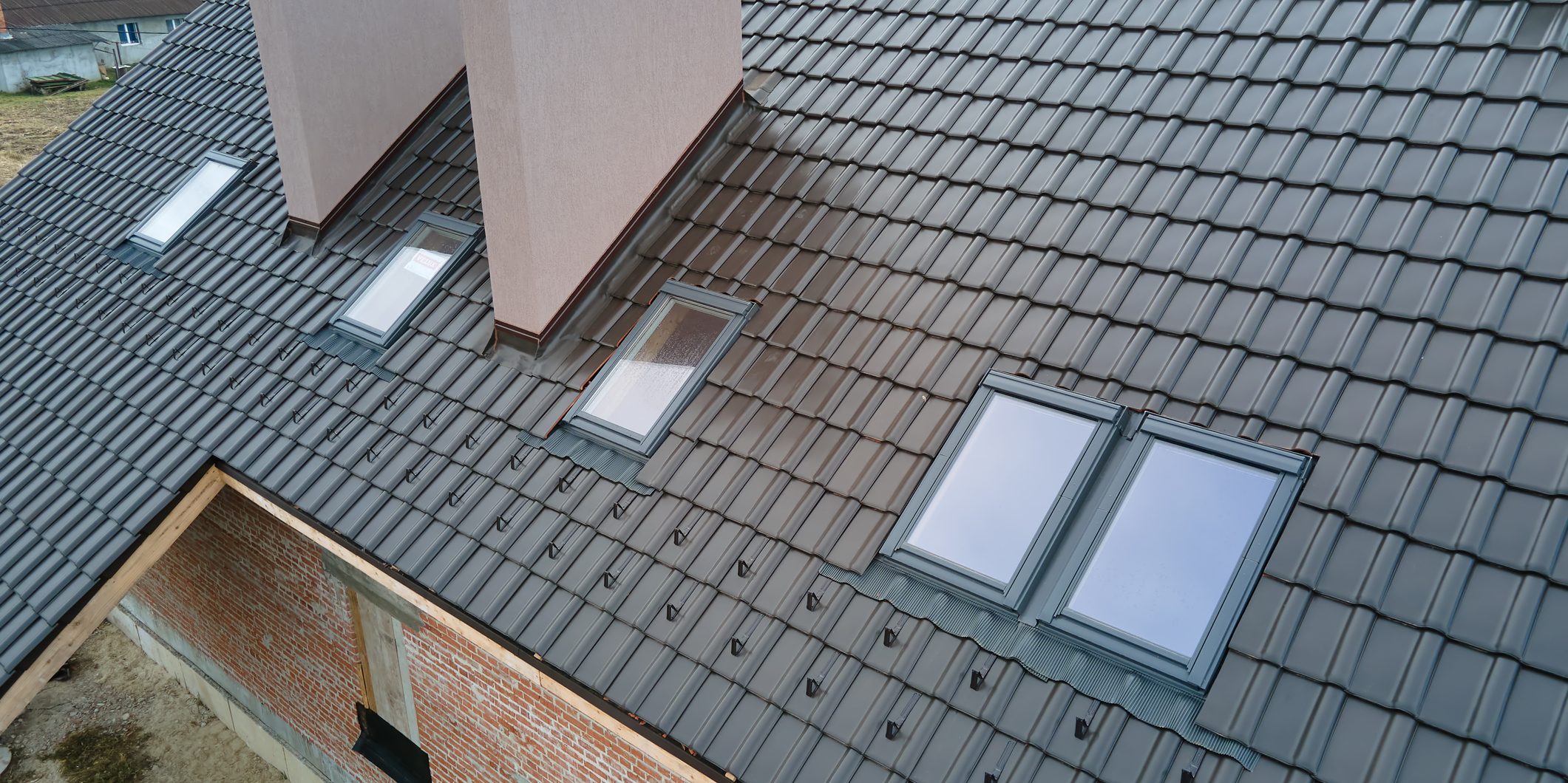 Tiled roof with multiple skylights.